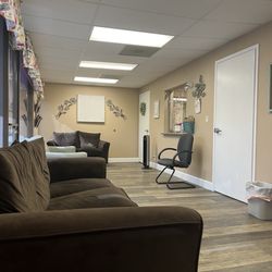 Life Choice Pregnancy Center - Front desk area from the far right couch plenty of comfortable space for sitting.
