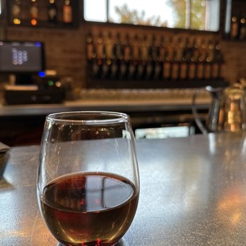 Four Eight Wineworks - a glass of wine on a bar - Wine Bars Near Me - Cottonwood, Arizona