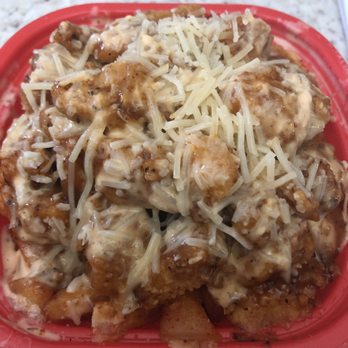 The Buffalo Spot - Carson - jamaican jerk chicken on top of siracha seasoned fries - Chicken Wings Near Me - Carson, California