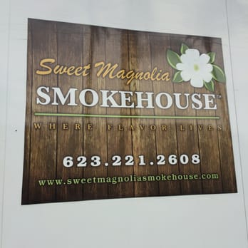 Sweet Magnolia Smokehouse - Sign on the side of the truck - Food Trucks Near Me