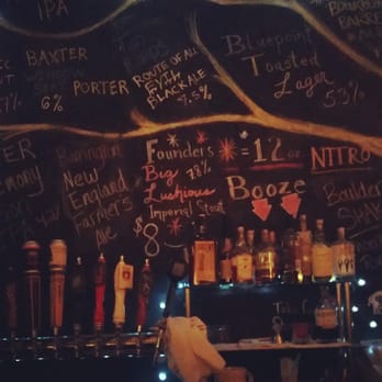 Thistle And Mirth - a bar with a lot of bottles on it - Bars Near Me - Pittsfield, Massachusetts