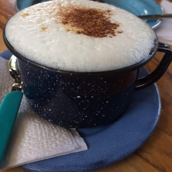 Geek&Coffee - Cappuccino in a tin cup in the hip little Geek & Coffee Cafe. Not pictured is the yummy German chocolate cake - Cafeteria Near Me - San Miguel de Allende, GUA