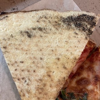 Fiorella's Italian Kitchen - Is this dried cornmeal on the back of each slice? - Pizza Near Me - Oxon Hill, Maryland