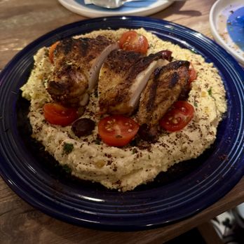 Kitty Dare - Berbere chicken served over the world's largest portion of hummus - Mediterranean Near Me - Atlanta, Georgia Kitty Dare - Berbere chicken served over the world's largest portion of hummus - Mediterranean Near Me - Atlanta, Georgia