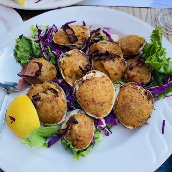 Adega Grill - Stuffed clams wrapped in bacon and calamari - Portuguese Near Me - Newark, New Jersey Adega Grill - Stuffed clams wrapped in bacon and calamari - Portuguese Near Me - Newark, New Jersey