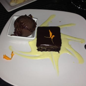 Farm & Table - Delectable decadent home made dark chocolate raspberry chili jam ice cream with flour less chocolate cake at Farm and Table. - New American Near Me - Albuquerque, New Mexico