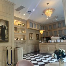 Love the checkerboard tile floors and pink crystal flower chandeliers! Love the checkerboard tile floors and pink crystal flower chandeliers!