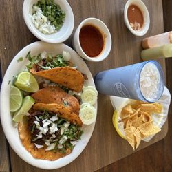 Restaurant & Taqueria La Blanca - Birria tacos with soup/dip,horchata,side of onions and cilantro (gratis),fresh tortilla chips and house hot sauces.