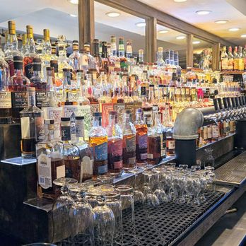 Bourbon's Kitchen & Cocktails - Bourbon counter...so many! - Cocktail Bars Near Me - Framingham, Massachusetts