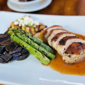Painted Pony - a plate of meat, asparagus, and mushrooms - New American Near Me - Saint George, Utah