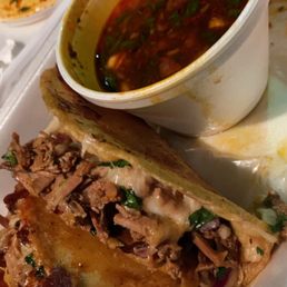 Quesotaco birria with consume Quesotaco birria with consume