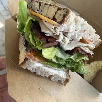 Helena Avenue Bakery - Classic Turkey Sandwich on Sourdough smoked cheddar, mayo, crispy bacon, heirloom tomato, served with salt & pepper potato chips - Bakeries Near Me - Santa Barbara, California Helena Avenue Bakery - Classic Turkey Sandwich on Sourdough smoked cheddar, mayo, crispy bacon, heirloom tomato, served with salt & pepper potato chips - Bakeries Near Me - Santa Barbara, California