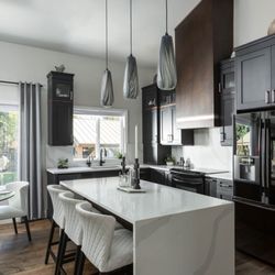 MN Stoneworks - Silestone Classic Calacatta quartz with waterfall and full height backsplash.