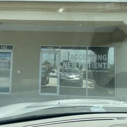 Sudeshna Mitra MD LLC - Front window clearly explaining they are accepting new patients. But once you're inside, it's obvious they're not.