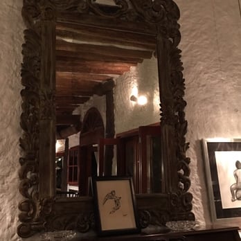 Hotel CasaSandra - Adobe lobby with art and books. - Hotels Near Me - Holbox, ROO