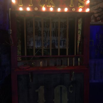 Tribute Store - Entrance to the store, a creepy looking carnival ticket booth. - Haunted Houses Near Me - Orlando, Florida