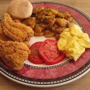 Photo of OB's Coffee Cafe - Oakland, CA, United States. Creole Breakfast - Cornmeal catfish, cheese grits(I don't like grits so he graciously replaced 'em with sauteed potatoes), eggs