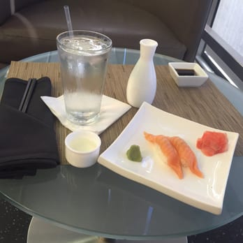 Wicker Park - Salmon nigiri with a small hot sake - Sushi Bars Near Me - Chicago, Illinois Wicker Park - Salmon nigiri with a small hot sake - Sushi Bars Near Me - Chicago, Illinois