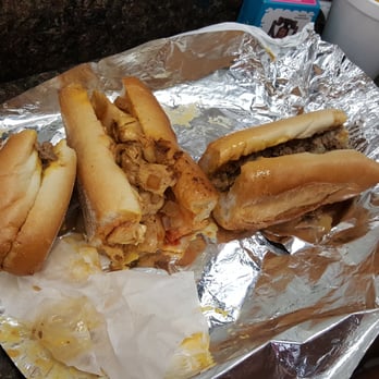Ishkabibble's - The chicken cheese steak in the middle with cheese whiz. The one on the right is the classic cheese steak with cheese whiz. - Cheesesteaks Near Me - Philadelphia, Pennsylvania Ishkabibble's - The chicken cheese steak in the middle with cheese whiz. The one on the right is the classic cheese steak with cheese whiz. - Cheesesteaks Near Me - Philadelphia, Pennsylvania