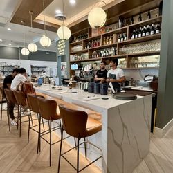LB Eatery & Wine - I want this stunning white marble island waterfall countertop in MY KITCHEN!!! Sighhhhh...