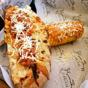 Humo Charcutería - Sausage Sandwich, topped off with Bacon and Cheese,  with a side of Corn on the Cob - Food Trucks Near Me - Tijuana, BCN