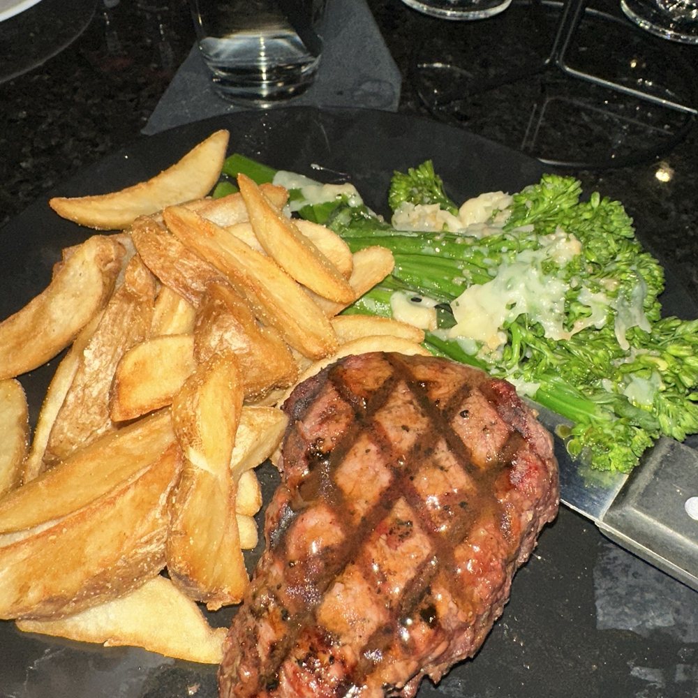 Queen City Tavern - Medium well Filet with potato wedges and broccolini - American Near Me - Olyphant, Pennsylvania Queen City Tavern - Medium well Filet with potato wedges and broccolini - American Near Me - Olyphant, Pennsylvania