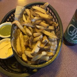 Fresh cut fries with roasted garlic aioli and chimichurri sauces .