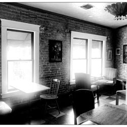 Jones Coffee Roasters - Second floor seating with large windows.