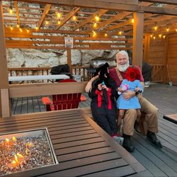 Riverview RV Park - Clubhouse deck with cozy firepits and propane grills. Perfect for gatherings and relaxing evenings.