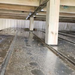 Wilbon Wood Works - The 4x4 post are set on corrugated metal with only plywood beneath and floor joist are breached only where visible if not underneath deck.