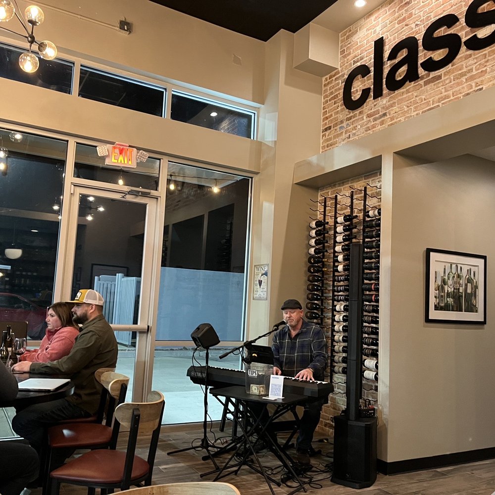 Classy Cork - people sitting at tables in a restaurant - Wine Bars Near Me - Spring, Texas