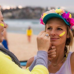The Spirit Bird Life - Happy bright yoga teacher.  Charity beach yoga for One Wave mental health awareness.  Sunrise yoga at Bondi Beach, Australia