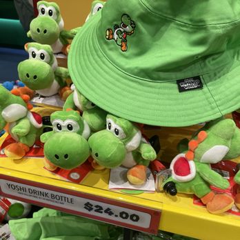 Super Nintendo World Store - Yoshi bucket hat and shoulder plush - Children's Clothing Near Me - Universal City, California Super Nintendo World Store - Yoshi bucket hat and shoulder plush - Children's Clothing Near Me - Universal City, California