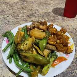 New Ming Garden Buffet and Grill - A selection of green beans, beef with mushrooms, mixed vegetables, and sesame chicken.