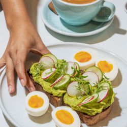 Avocado toast with pasture-raised eggs - a clean, healthy all-day breakfast option.
