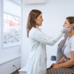 Woman being examined by doc