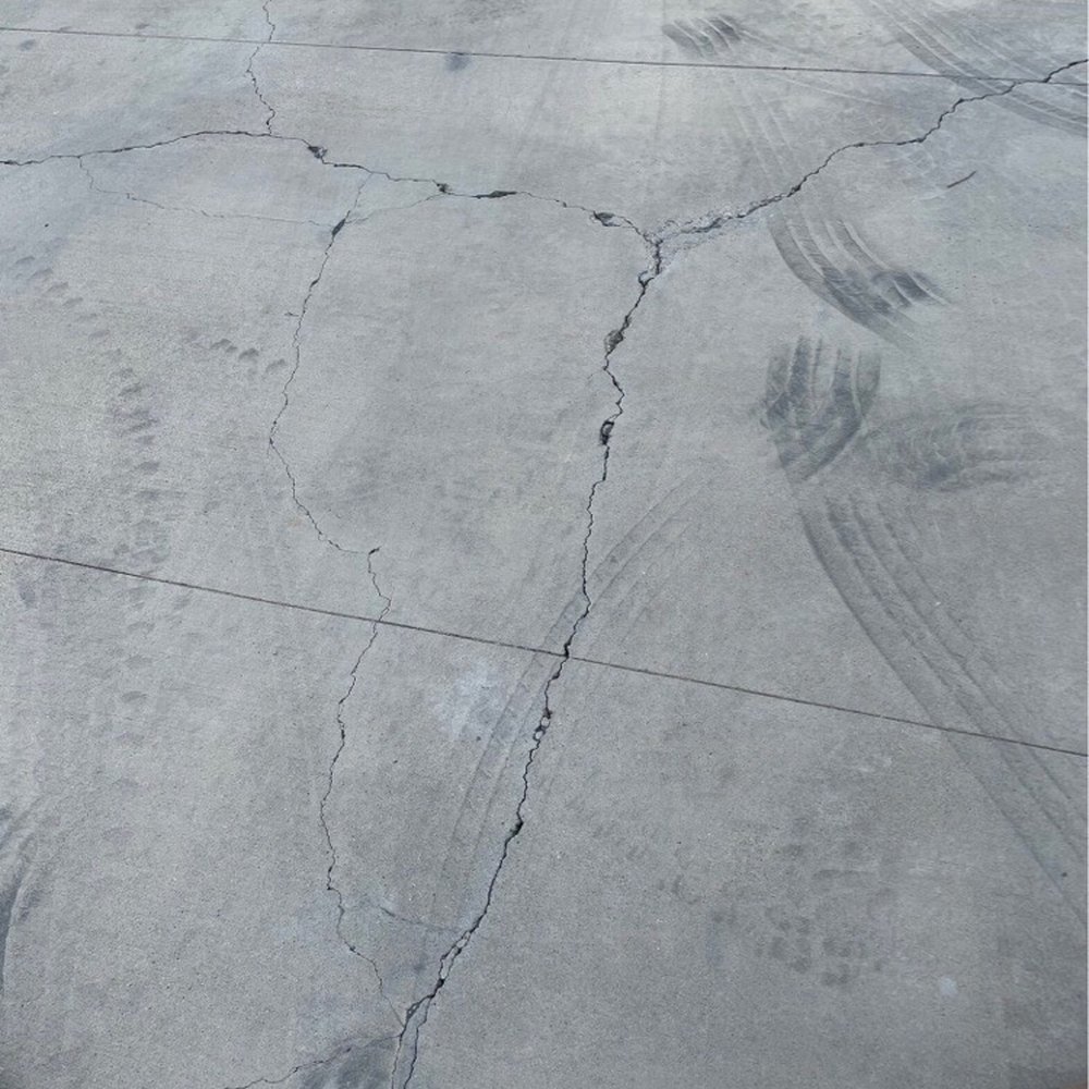 Old ugly driveway with thin joints. Old ugly driveway with thin joints.