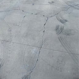Old ugly driveway with thin joints. Old ugly driveway with thin joints.