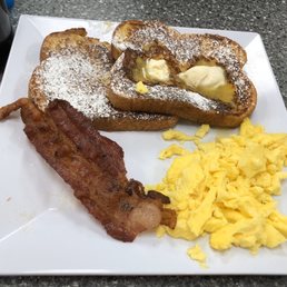 "Sunny Sweet Cakes" $6.49: mine, with French toast, scrambled eggs & bacon "Sunny Sweet Cakes" $6.49: mine, with French toast, scrambled eggs & bacon