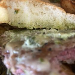 Rosebud's Cafe - This is the hamburger I got raw and some smeared green stuff on it nasty
