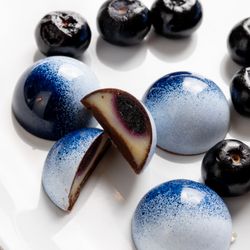Chocs ‘N Boxes - Indulge in our Blueberry Ganache: a luscious mix of blueberry puree, white and dark chocolate, with a hint of Chambord. Delicious!