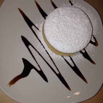 El Chullo Peruvian Restaurant & Bar - Alfajores- two cookies filled with dulce de leche topped w/ confectionery sugar. Aka: heaven. - Peruvian Near Me - Phoenix, Arizona El Chullo Peruvian Restaurant & Bar - Alfajores- two cookies filled with dulce de leche topped w/ confectionery sugar. Aka: heaven. - Peruvian Near Me - Phoenix, Arizona