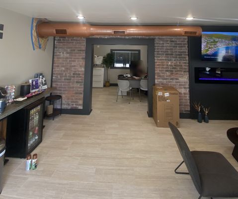 Office Remodel (interior) - Opened up a brick wall to combine 2 spaces and create a larger office. Office Remodel (interior) - Opened up a brick wall to combine 2 spaces and create a larger office.