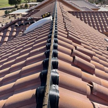 Roofing Proaz - Adding weather guard to a tile roof to prolong the life of the roof by routing water away from the underlayment and back onto the tiles. - Roofing Near Me - Phoenix, Arizona