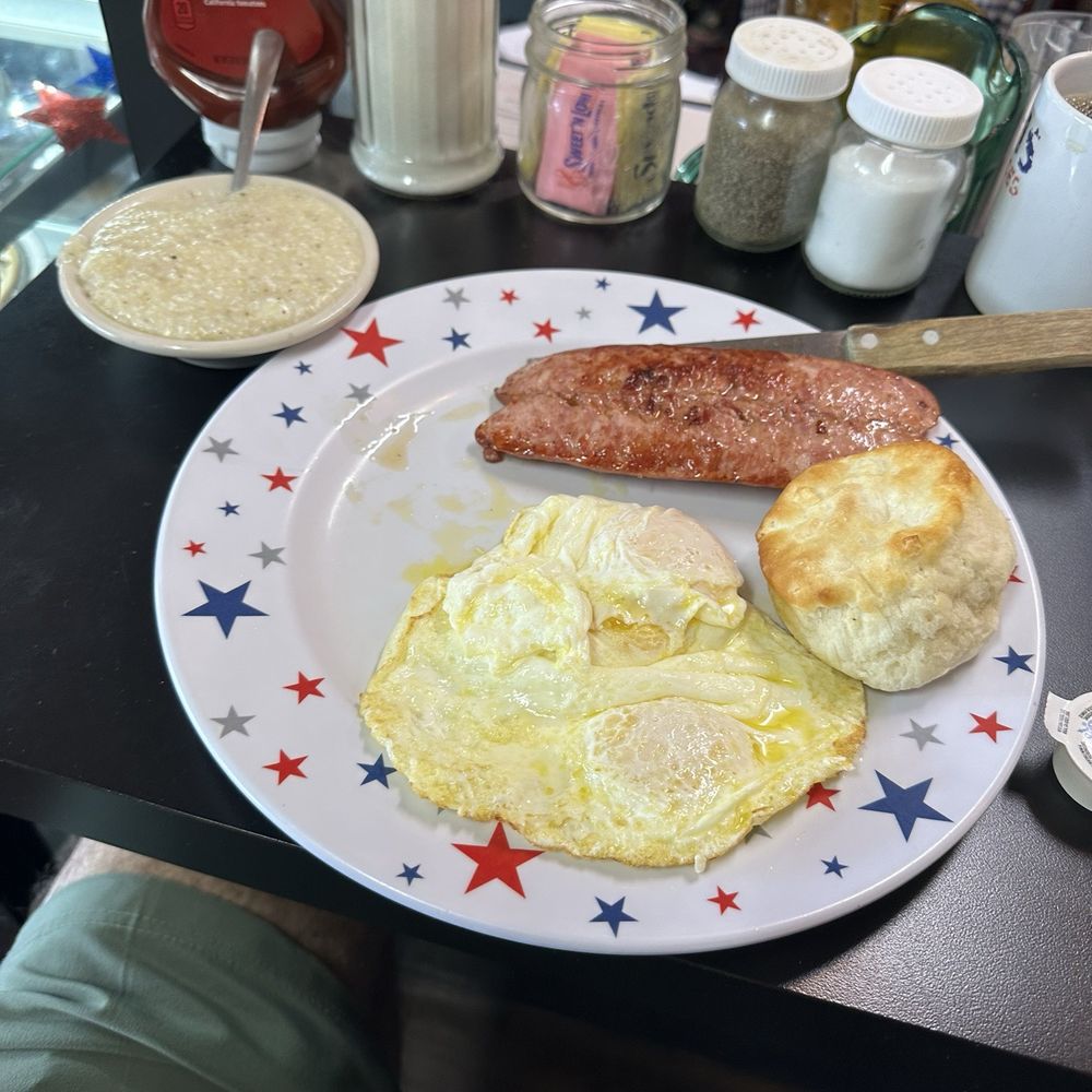 Masons - 2 Eggs over easy with country sausage and grits and a biscuit - Breakfast & Brunch Near Me - Milton, Florida