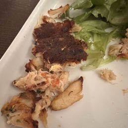 Burnt crab cake. Had to cut the bottom off. Burnt crab cake. Had to cut the bottom off.