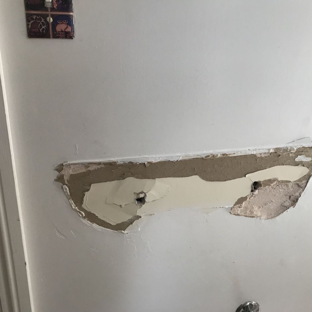 Wall damaged by "Roberts Flooring". I was unable to hang a new sink and had to cut a much bigger hole and repair...