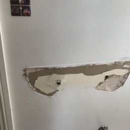 Wall damaged by "Roberts Flooring". I was unable to hang a new sink and had to cut a much bigger hole and repair... Wall damaged by "Roberts Flooring". I was unable to hang a new sink and had to cut a much bigger hole and repair...