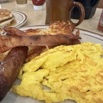 Flap Jack Family Restaurant - Bacon and sausage were good. The eggs aren't what I wanted and were probably a little overdone, but they were fine enough. - Breakfast & Brunch Near Me - Lansing, Michigan
