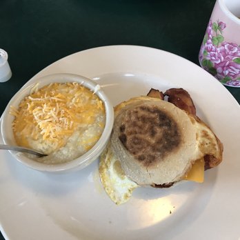 CJ's Kitchen & Grille - Bacon, egg and cheese on an English muffin with a side of cheese grits (perfectly done). - American Near Me - Pensacola, Florida CJ's Kitchen & Grille - Bacon, egg and cheese on an English muffin with a side of cheese grits (perfectly done). - American Near Me - Pensacola, Florida